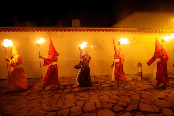Framed Print : Penitents attend the Procession of the Torches during Holy Week in Goias Velho, west Framed Print : Penitents attend the Procession of the Torches during Holy Week in Goias Velho, west