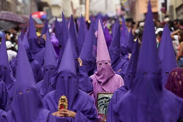 Penitents participate in a procession rally in Quito