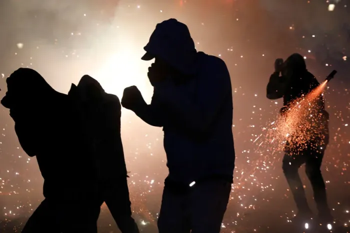 Framed Print : People enjoy fireworks exploding from a traditional bull figure known as El Torito in Framed Print : People enjoy fireworks exploding from a traditional bull figure known as El Torito in