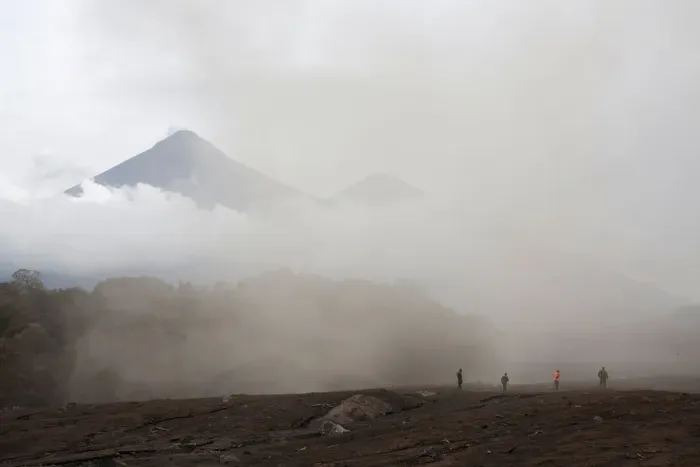 Framed Print : People inspect an affected area after the eruption of the Fuego volcano in Escuintla Framed Print : People inspect an affected area after the eruption of the Fuego volcano in Escuintla