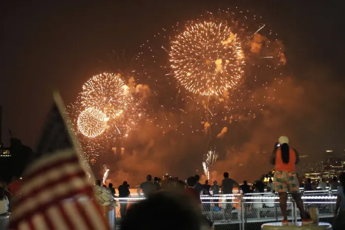 Framed Print : People look at fireworks exploding during Macys Independence Day celebration as seen Framed Print : People look at fireworks exploding during Macys Independence Day celebration as seen