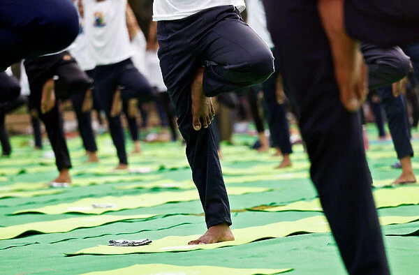 People perform yoga at India Gate on International Yoga Day in New Delhi