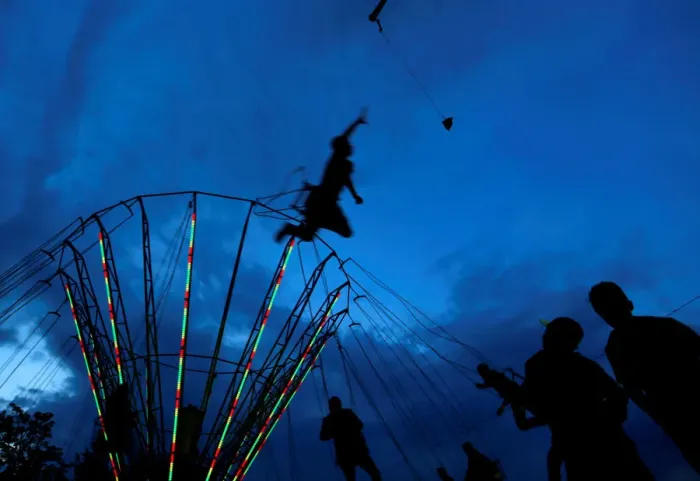 Framed Print : People ride on a swing carousel as part of the traditional celebration of Saint George s Framed Print : People ride on a swing carousel as part of the traditional celebration of Saint George s