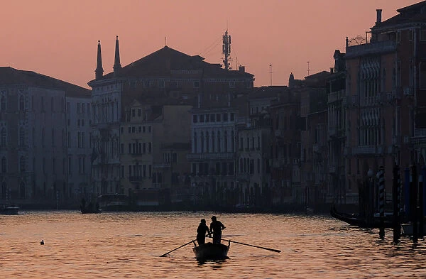 People row on Grand Canal in Venice