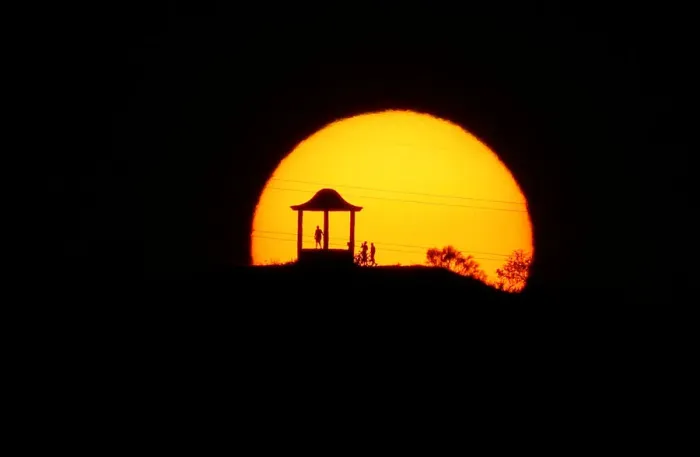 Framed Print : People are silhouetted against the setting sun at El Mirador de la Alemana in Malaga Framed Print : People are silhouetted against the setting sun at El Mirador de la Alemana in Malaga