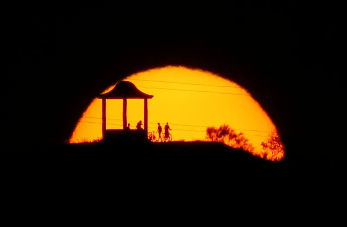 Framed Print : People are silhouetted against the setting sun at El Mirador de la Alemana in Malaga Framed Print : People are silhouetted against the setting sun at El Mirador de la Alemana in Malaga