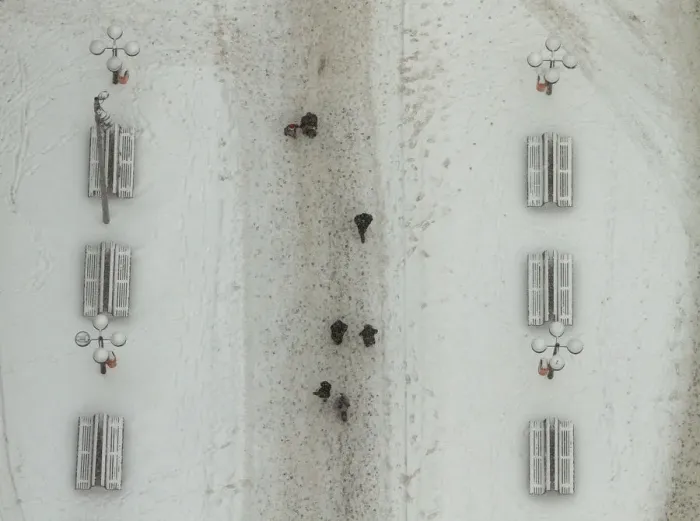 Framed Print : People walk across snow covered street in Berlin