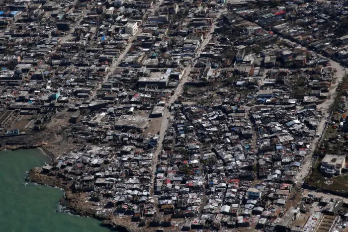 Framed Print : People walk down streets next to destroyed houses after Hurricane Matthew hit Jeremie Framed Print : People walk down streets next to destroyed houses after Hurricane Matthew hit Jeremie