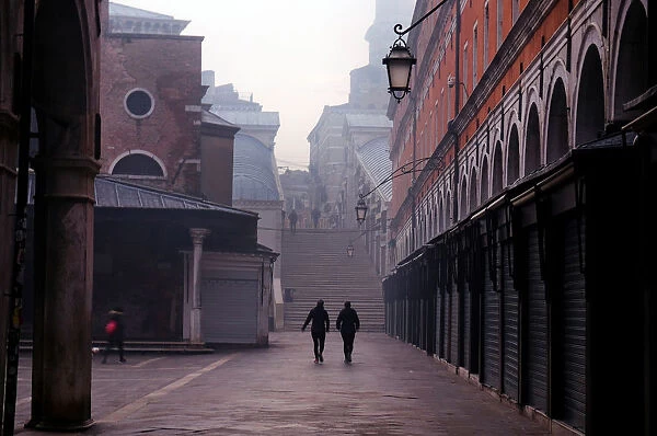 People walk in Venice