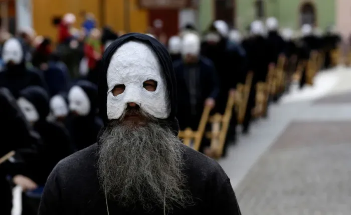 Framed Print : People wearing masks march through the streets during Easter celebrations in Ceske