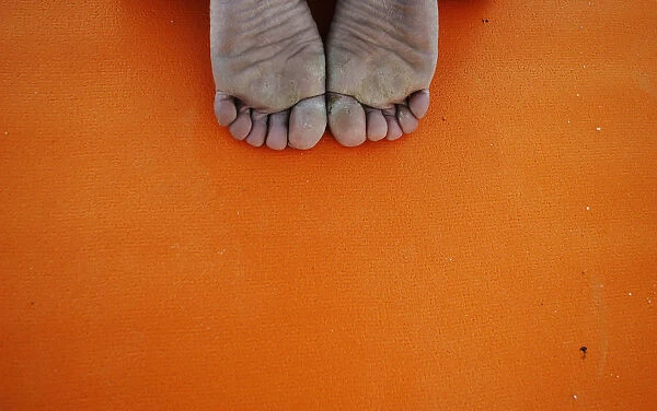 A person takes part in a free yoga class at the Parque del Oeste in Madrid
