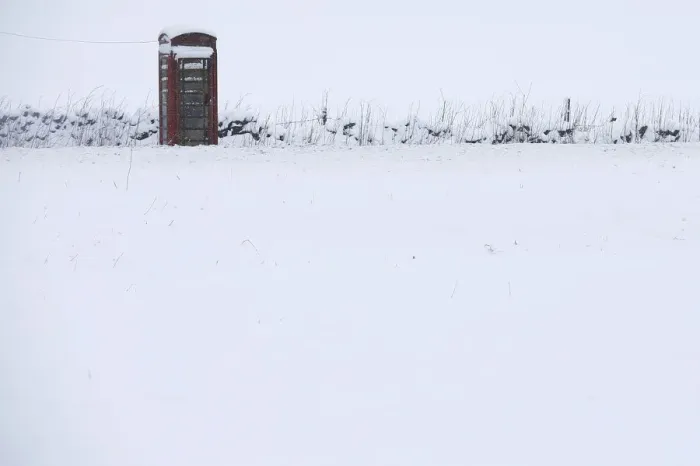 Framed Print : A phone box stands in snow in Newhaven