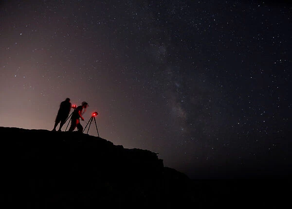 Photographers take pictures of stars and the Milky Way at Rdum il-Qammieh