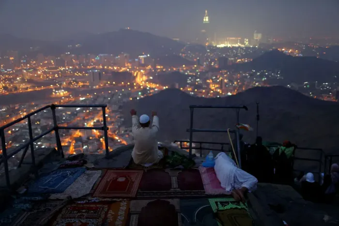 Framed Print : A pilgrim prays at Mount Al-Noor ahead of the annual haj pilgrimage in the holy city of Framed Print : A pilgrim prays at Mount Al-Noor ahead of the annual haj pilgrimage in the holy city of
