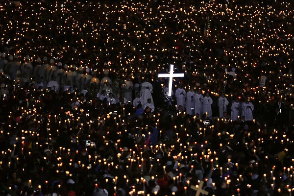 Pilgrims attend a candlelight vigil at the Catholic shrine of Fatima