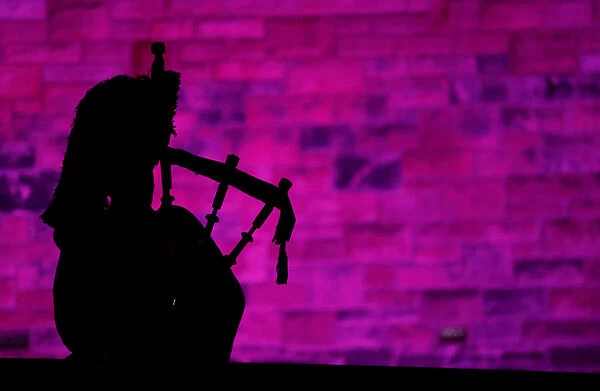 A piper plays a tune at Edinburgh Castle to herald the New Year during the Hogmanay