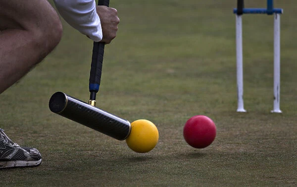 A player takes a stroke during the fifth annual Pacific Cup croquet tournament in