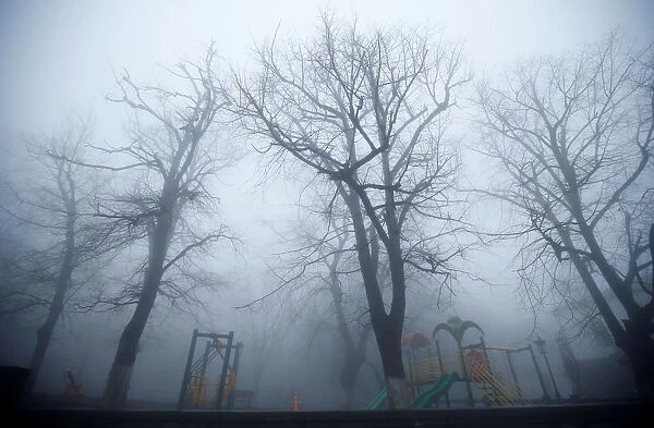 A playground is pictured on a foggy day in Sighnaghi