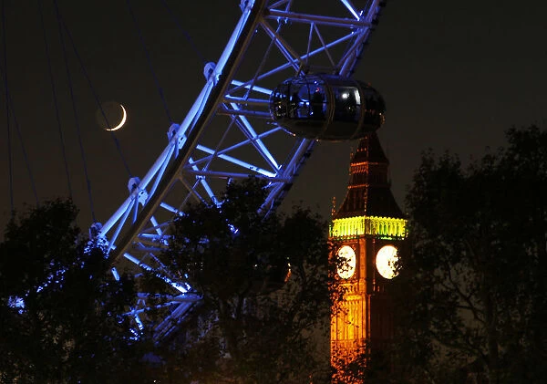 A pod from the London Eye is seen in front of Big Ben at the Houses of Parliament