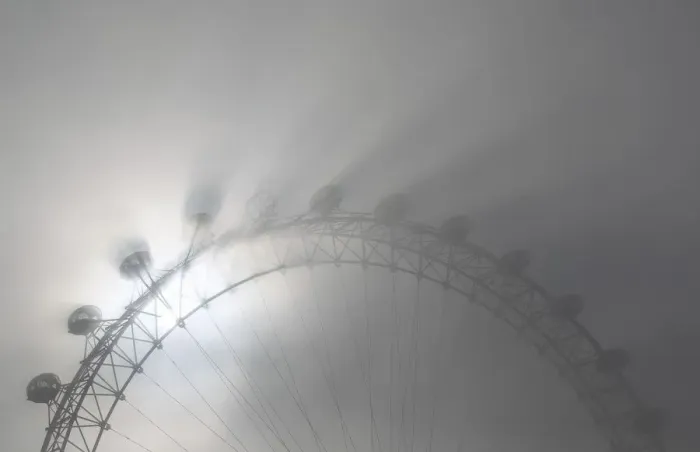 Framed Print : The pods on the London Eye casts shadows against a thick morning fog as the spring Framed Print : The pods on the London Eye casts shadows against a thick morning fog as the spring