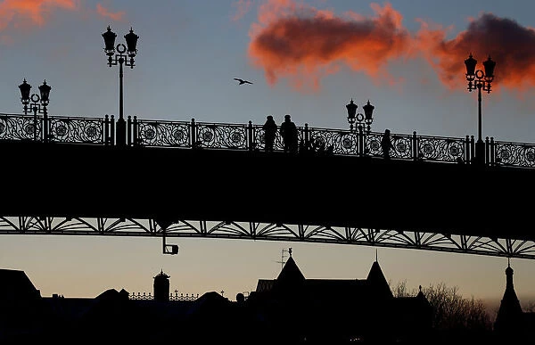 Police officers are seen standing on the Patriarchal Bridge over the Moskva river in