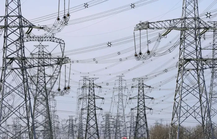 Framed Print : Power lines are seen along a highway on the outskirts of Beijing