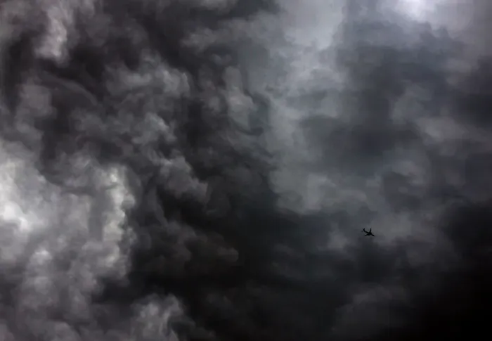 Framed Print : A Qantas Airways Boeing 737-800 plane flies near storm clouds above Sydney
