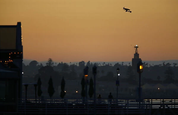 A radio-controlled flying witch travels across the ocean waters of Coronado, California