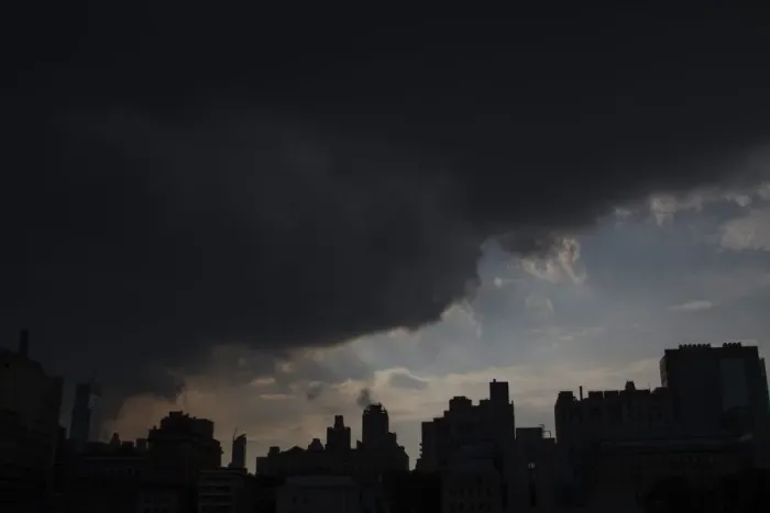 Framed Print : Rain clouds approach buildings in Midtown Manhattan