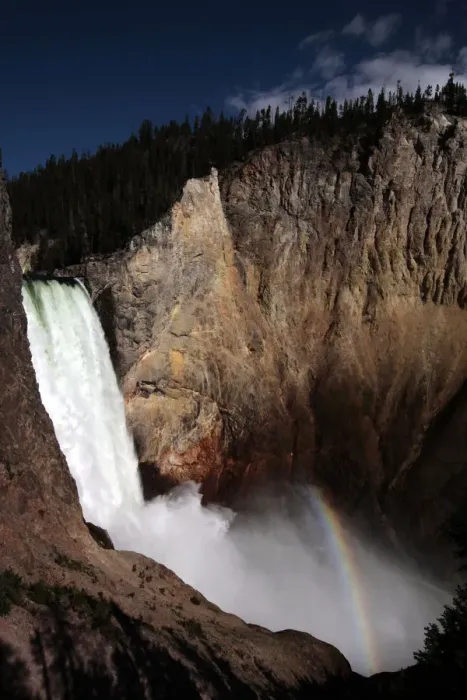 Framed Print : A rainbow of light is seen at the base of Yellowstone River Lower Falls in Yellowstone