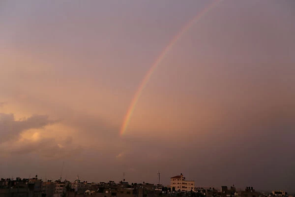 Rainbow is seen over houses in Khan Younis in the southern Gaza Strip