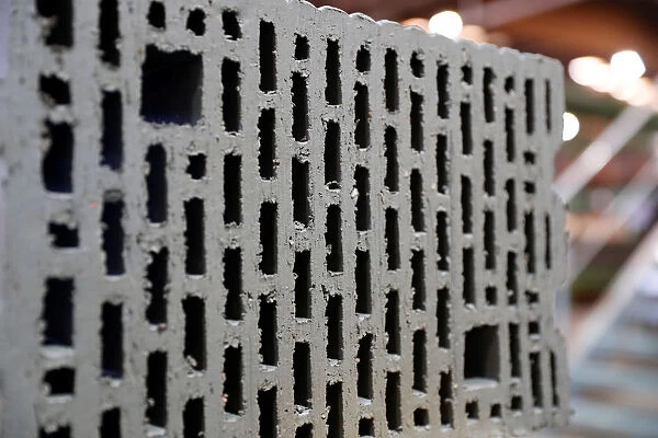 A raw clay brick is seen in the Wienerberger brick factory in Hennersdorf