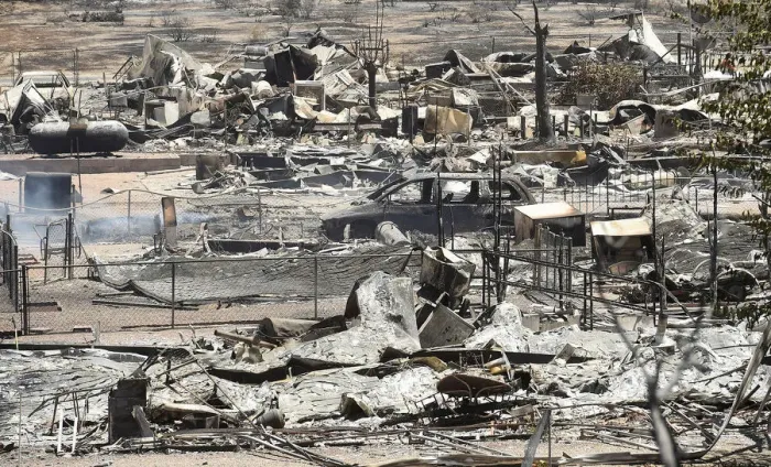 Framed Print : The remains of scorched homes line a street after the Erskine Fire burned through South