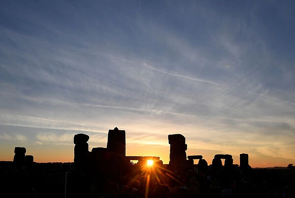 Revellers welcome in the Summer Solstice at Stonehenge stone circle in southwest Britain