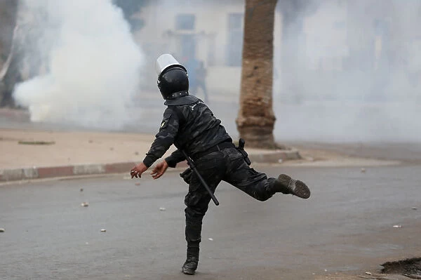 Riot police clash with protesters during demonstrations against rising prices
