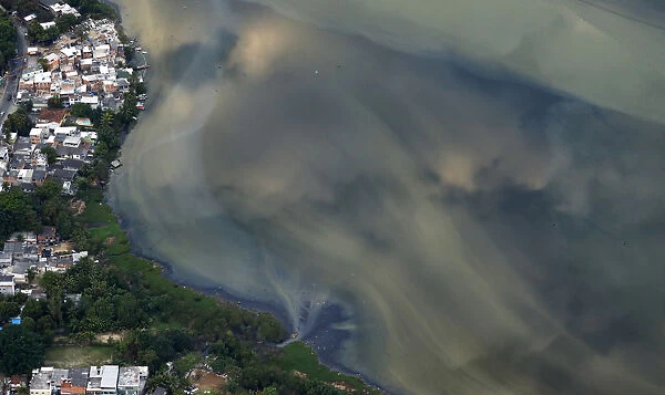 A river ends in Rio bay in Rio de Janeiro