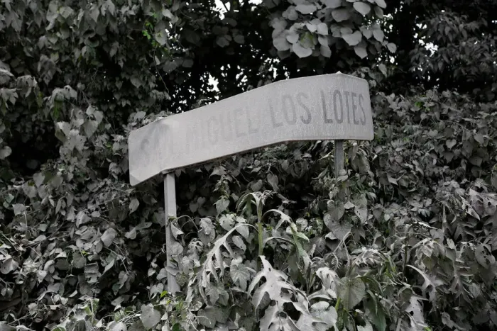 Framed Print : A road sign covered with ash is seen after Fuego volcano erupted in Escuintla Framed Print : A road sign covered with ash is seen after Fuego volcano erupted in Escuintla