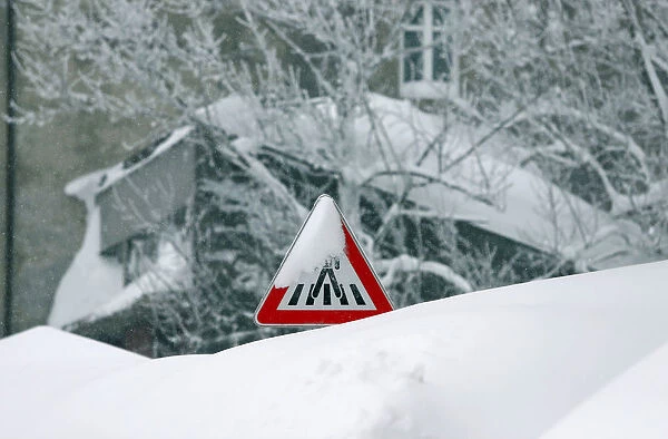 A road sign covered with snow is seen in Delnice