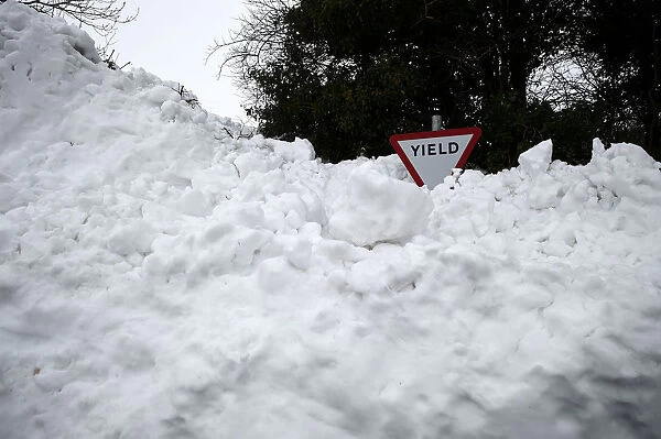 A road sign is seen submerged in deep snow in Kilteel