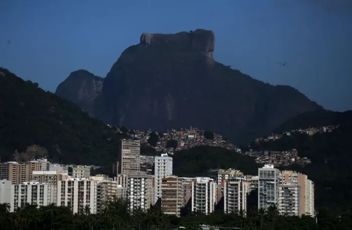 Framed Print : The Rocinha slum is see behind buildings in Rio de Janeiro Framed Print : The Rocinha slum is see behind buildings in Rio de Janeiro