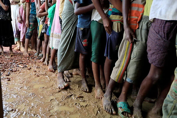 Rohingya refugees line up at registration center in Kutupalong refugees camp in Cox s
