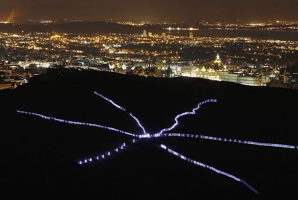 Runners taking part in NVAs Speed of Light create visual display with their light suits
