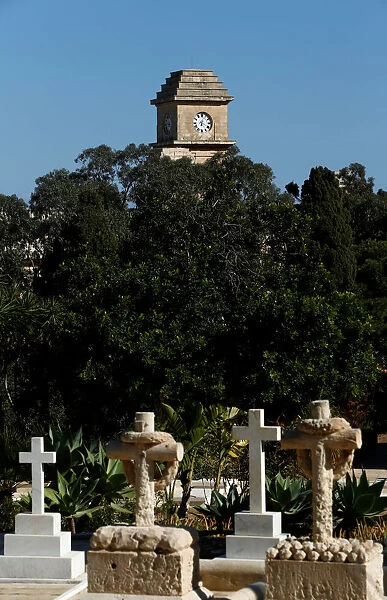 The Saint Patricks Barracks clock tower is seen from the Pembroke Military Cemetery in