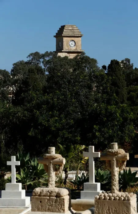 Framed Print : The Saint Patricks Barracks clock tower is seen from the Pembroke Military Cemetery in