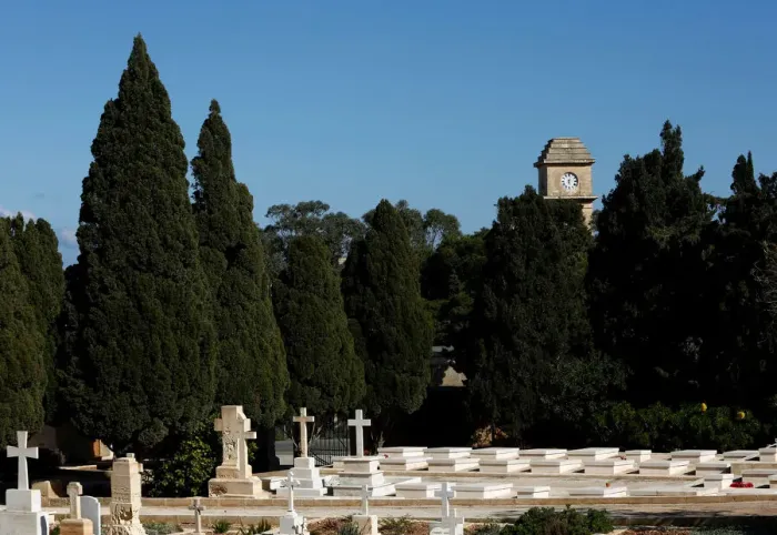 Framed Print : The Saint Patricks Barracks clock tower is seen from the Pembroke Military Cemetery in Framed Print : The Saint Patricks Barracks clock tower is seen from the Pembroke Military Cemetery in