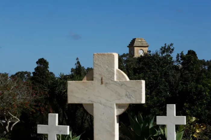 Framed Print : The Saint Patricks Barracks clock tower is seen from the Pembroke Military Cemetery in Framed Print : The Saint Patricks Barracks clock tower is seen from the Pembroke Military Cemetery in