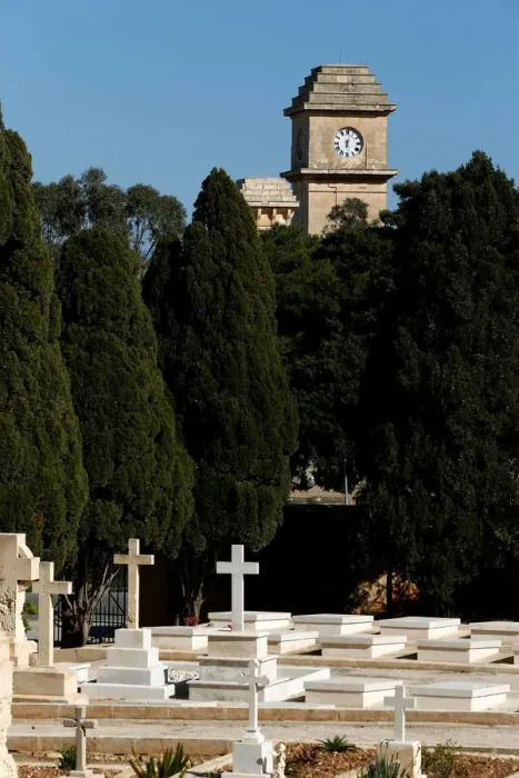 Framed Print : The Saint Patricks Barracks clock tower is seen from the Pembroke Military Cemetery in Framed Print : The Saint Patricks Barracks clock tower is seen from the Pembroke Military Cemetery in