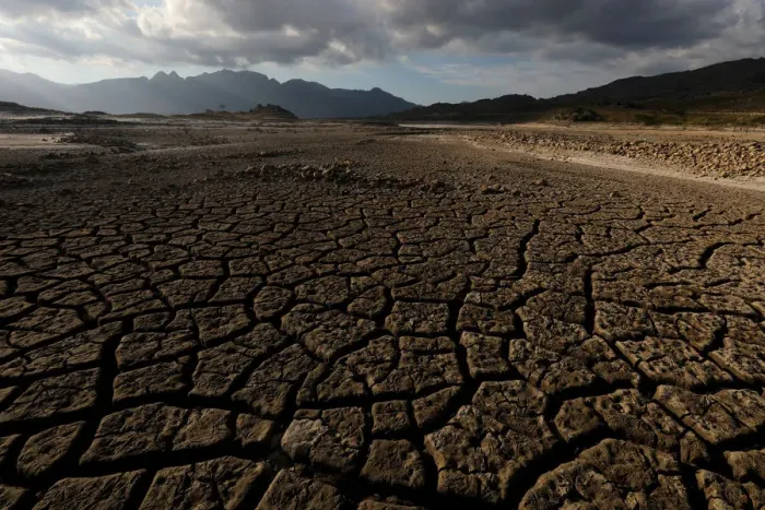 Framed Print : Sand blows across a normally submerged area at Theewaterskloof dam near Cape Town