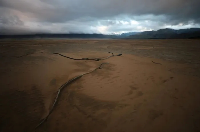 Framed Print : Sand blows across a normally submerged area at Theewaterskloof dam near Cape Town