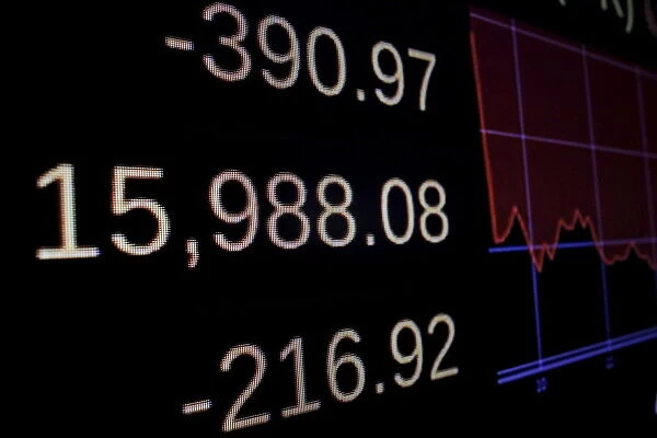 A screen displays the Dow Jones Industrial Average after the closing bell on the floor of